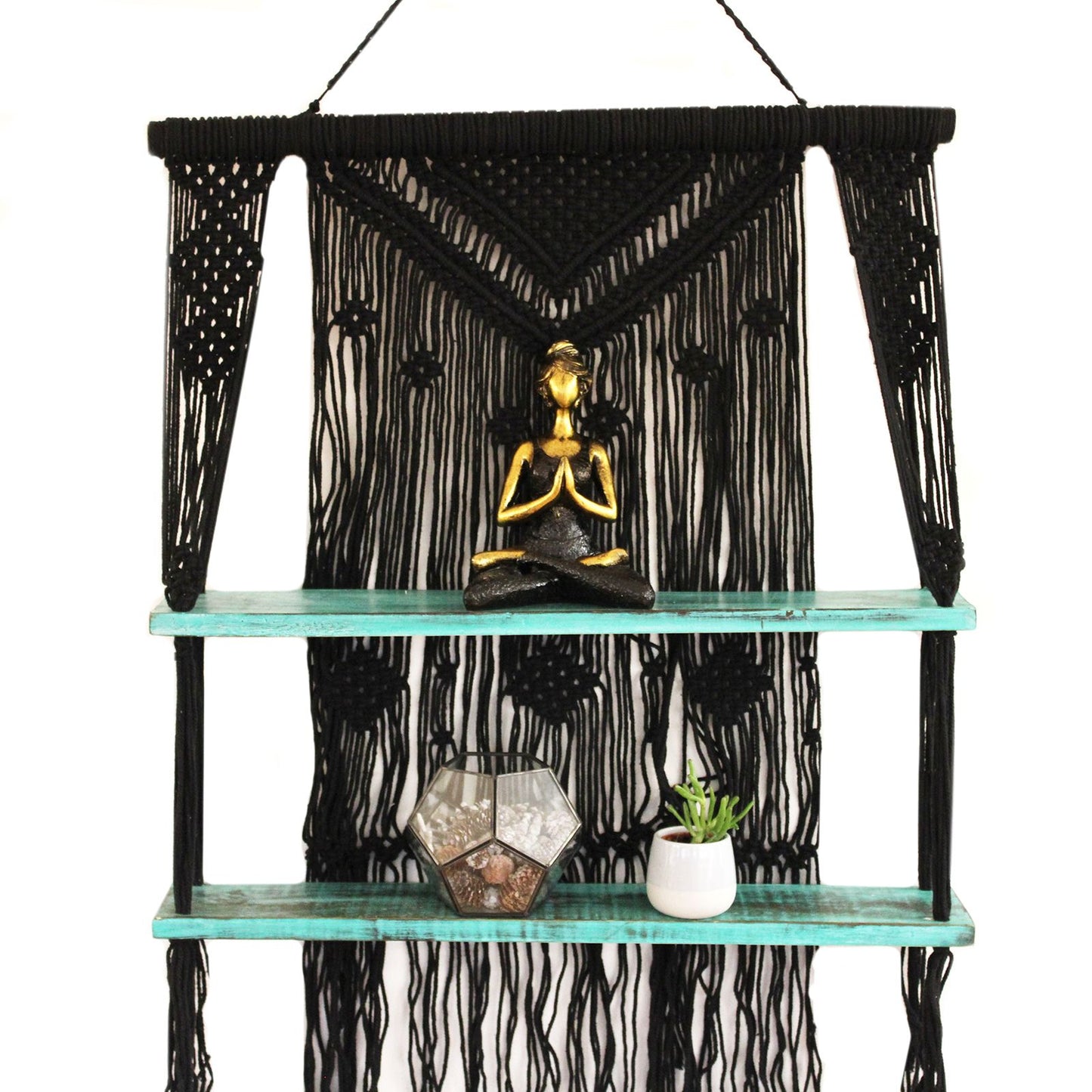 Handmade black macrame hanging shelf featuring turquoise bead details and a natural wooden platform for small home decor.
