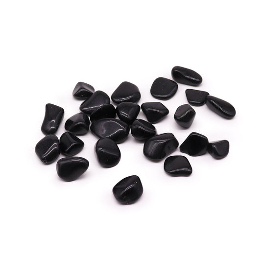Smooth polished large black obsidian tumbled stones with a reflective glassy surface.
