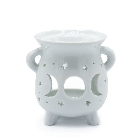 White ceramic cauldron-shaped oil burner featuring cut-out moon phase details on a smooth finish.