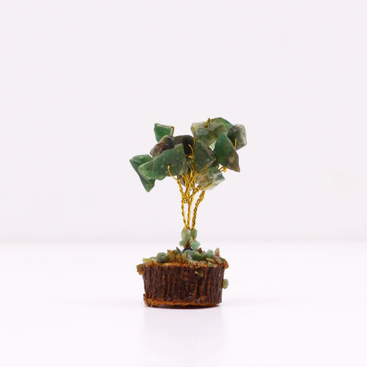 Handcrafted mini gemstone tree with green aventurine crystal leaves on a natural wood base.