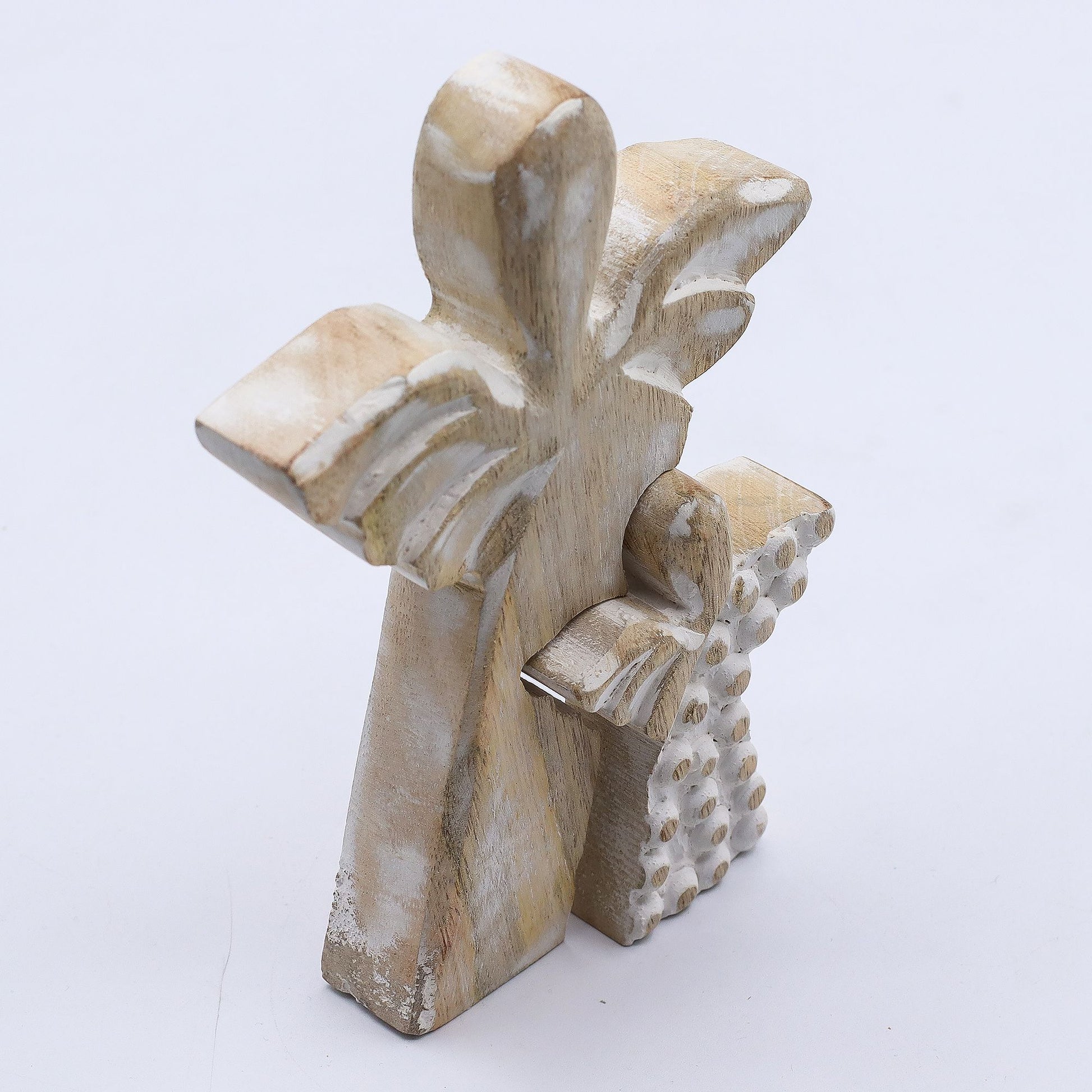 Hand-carved mango wood angel figurine with a whitewash finish, featuring a large angel sheltering a smaller one.