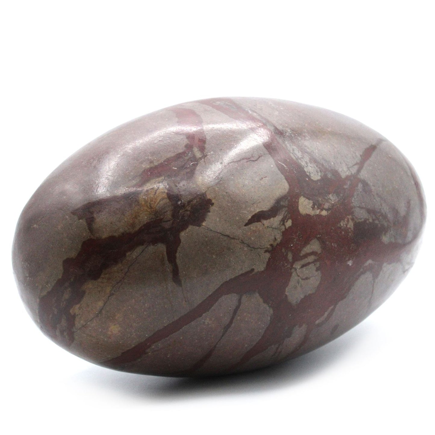 Large smooth egg-shaped Shiva Lingam stone with natural earth-toned markings and a polished finish.