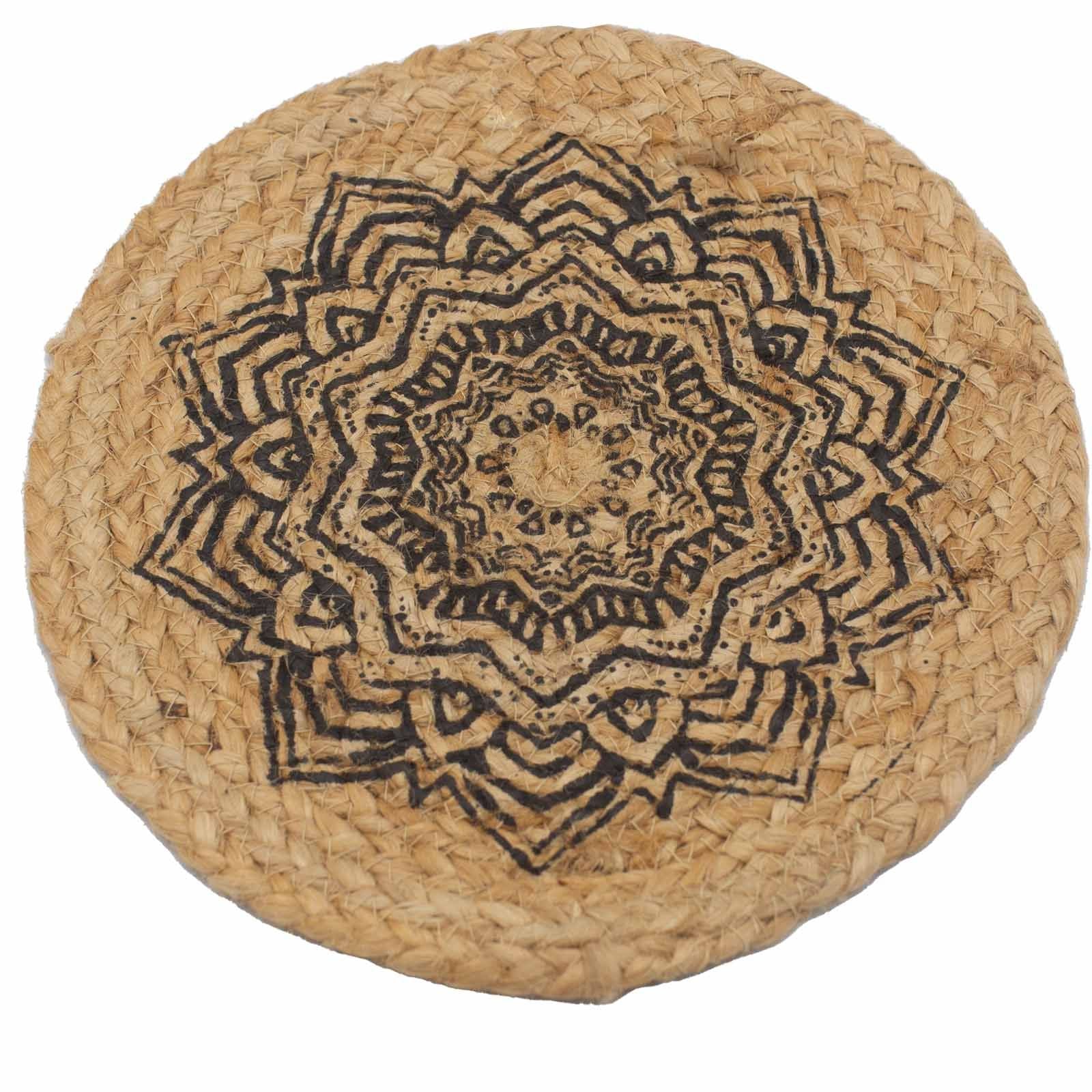 Round natural jute placemat featuring an intricate black mandala print on a rustic textured surface.