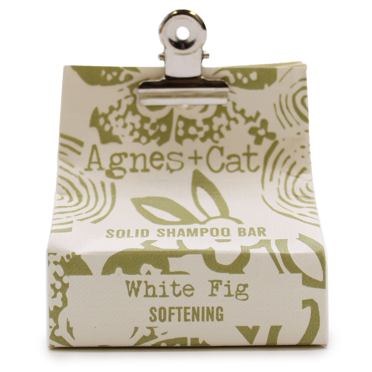Circular white textured solid shampoo bar enriched with coconut oil for eco-friendly hair care.