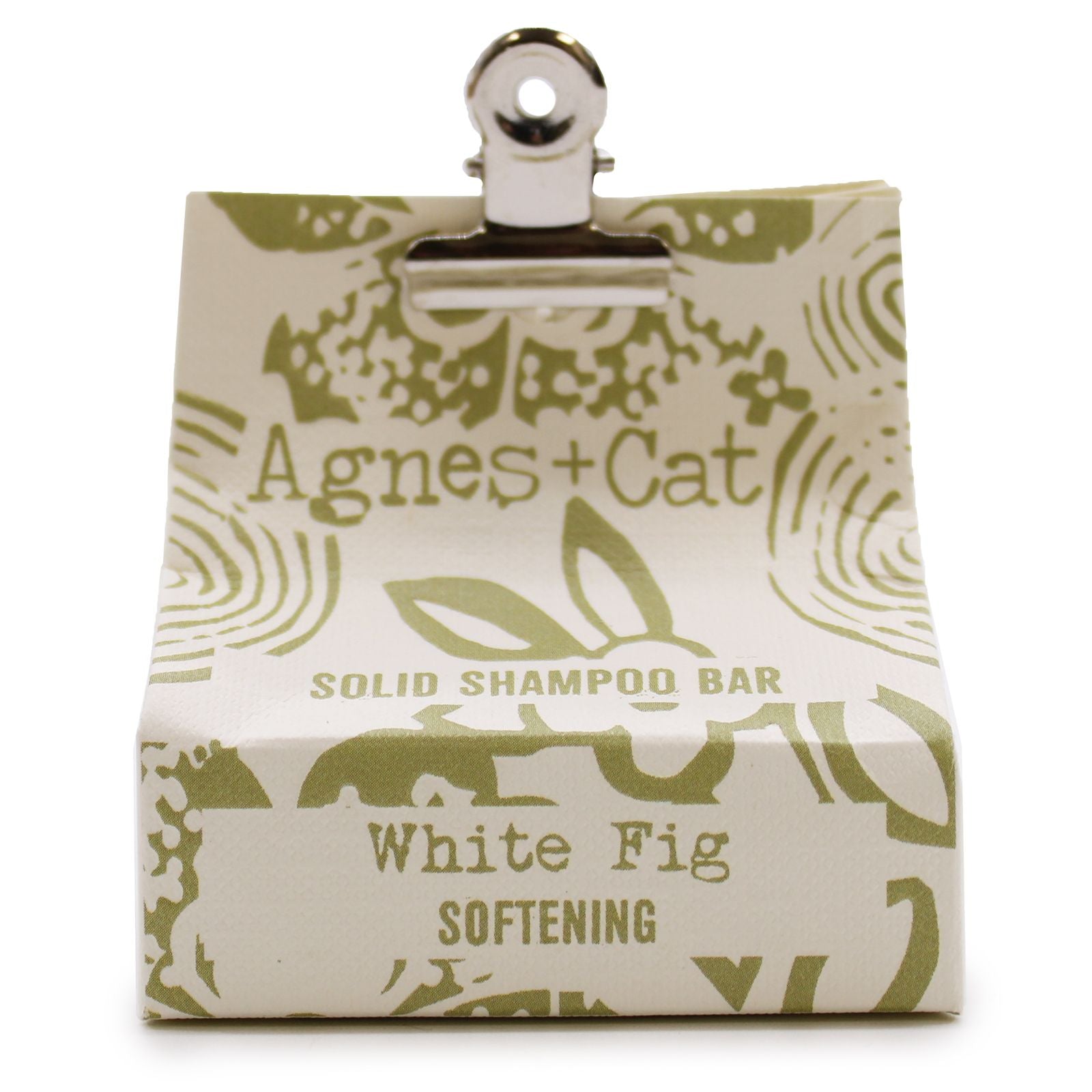 Circular white textured solid shampoo bar enriched with coconut oil for eco-friendly hair care.