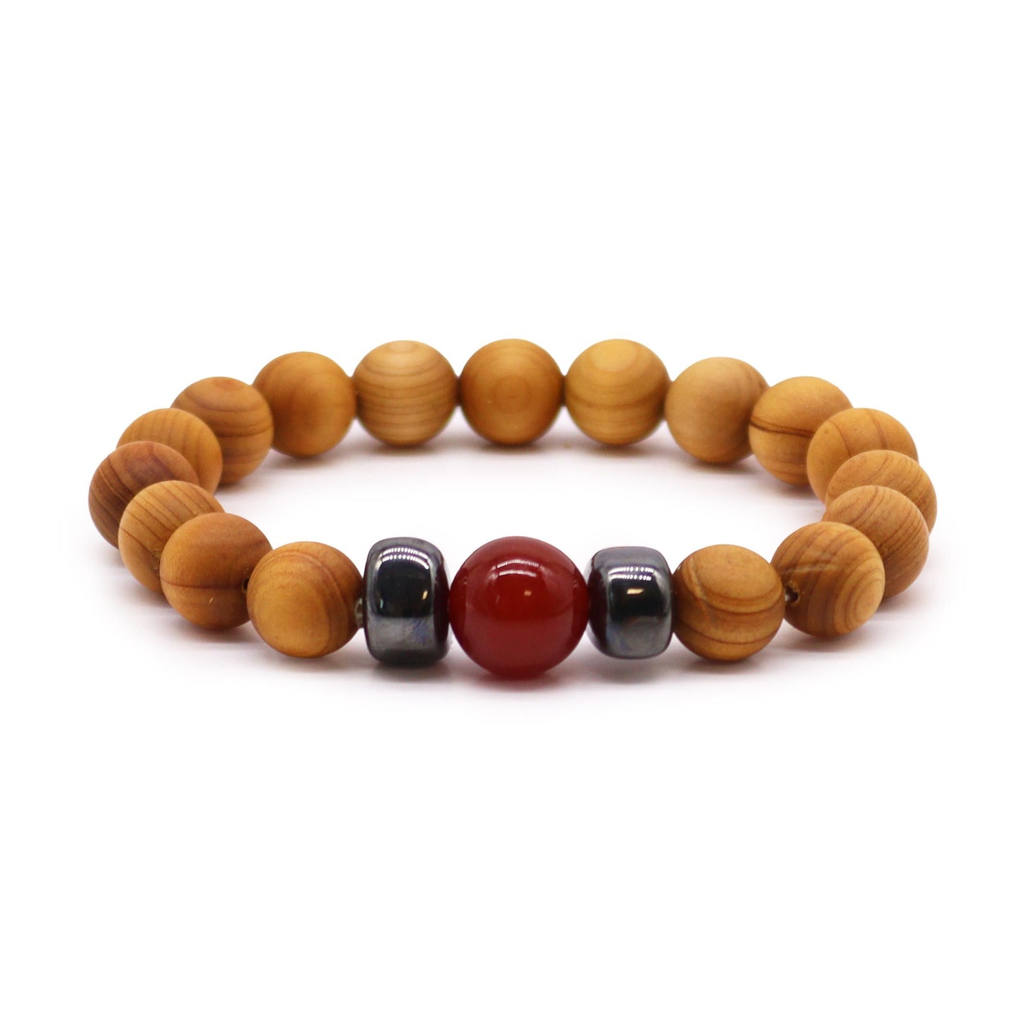 Handcrafted cedarwood bangle featuring a vibrant red jasper stone centrepiece for root chakra grounding.