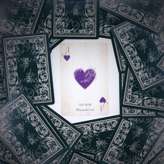Intricate fairy-themed playing and oracle cards with aged, ethereal tones and mystical illustrations.