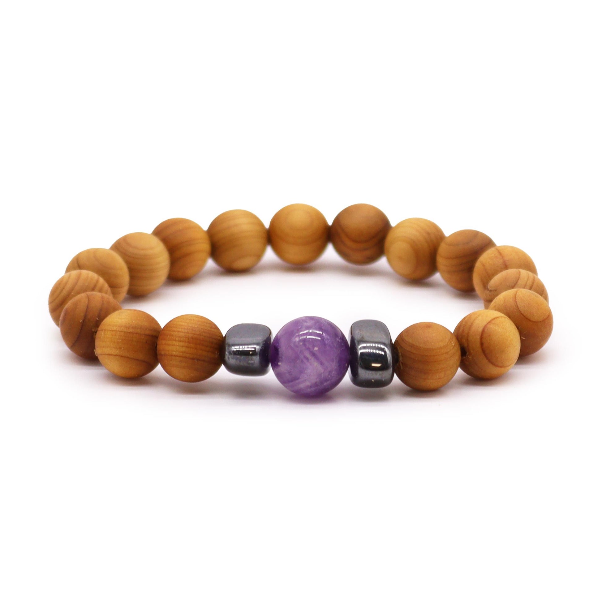 Handcrafted cedarwood bangle featuring purple amethyst beads, designed for third eye chakra spiritual alignment.