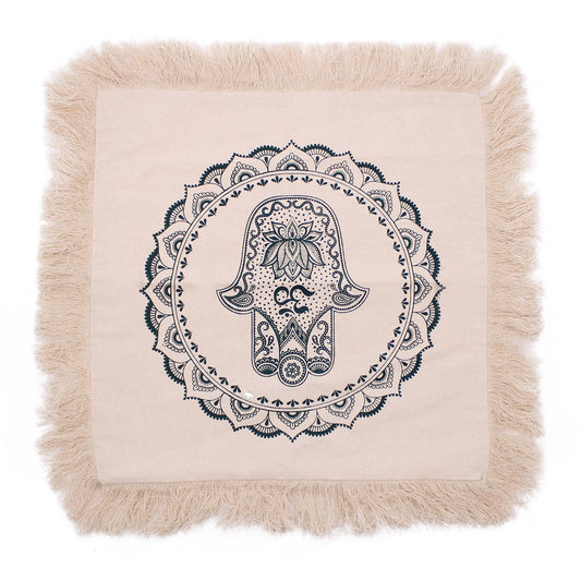 Square green cushion featuring an intricate white Hamsa hand and mandala pattern design.