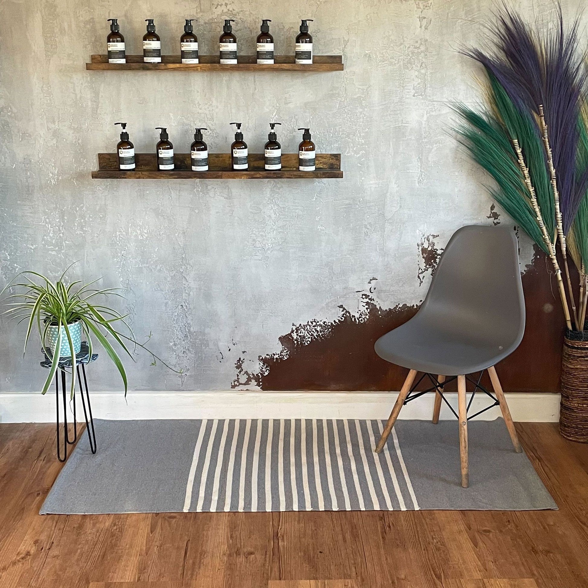 Handcrafted grey woven cotton rug in a rectangular yoga mat size with a neutral textured finish.