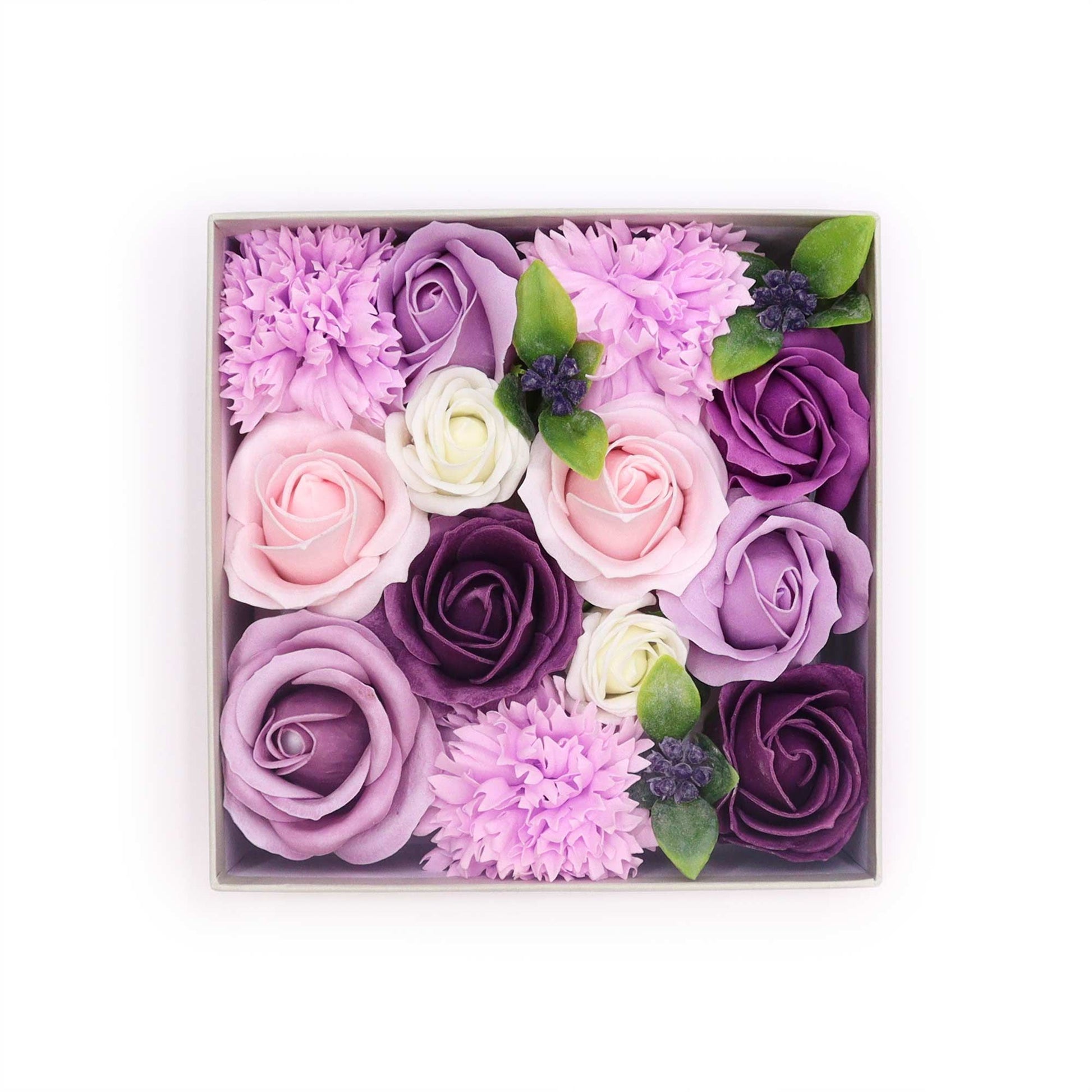 Elegant square gift box filled with realistic purple soap roses and carnations in a regal floral arrangement.