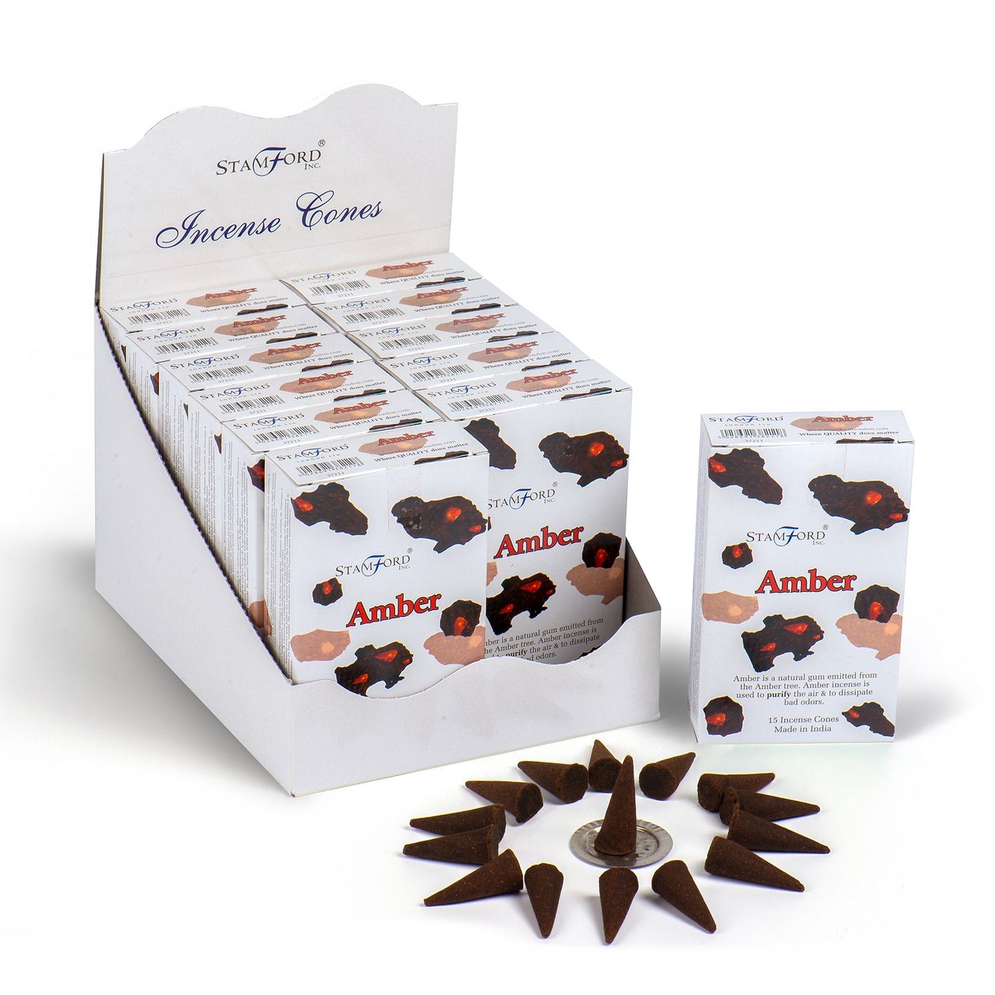Several small conical dark brown incense cones arranged on a flat surface.
