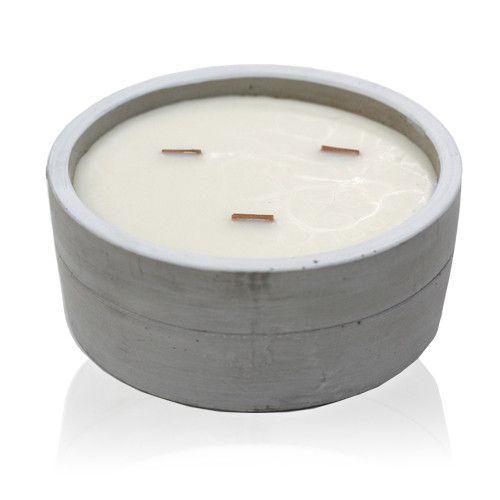 Large round grey concrete candle pot with a natural wooden wick and smooth wax surface.