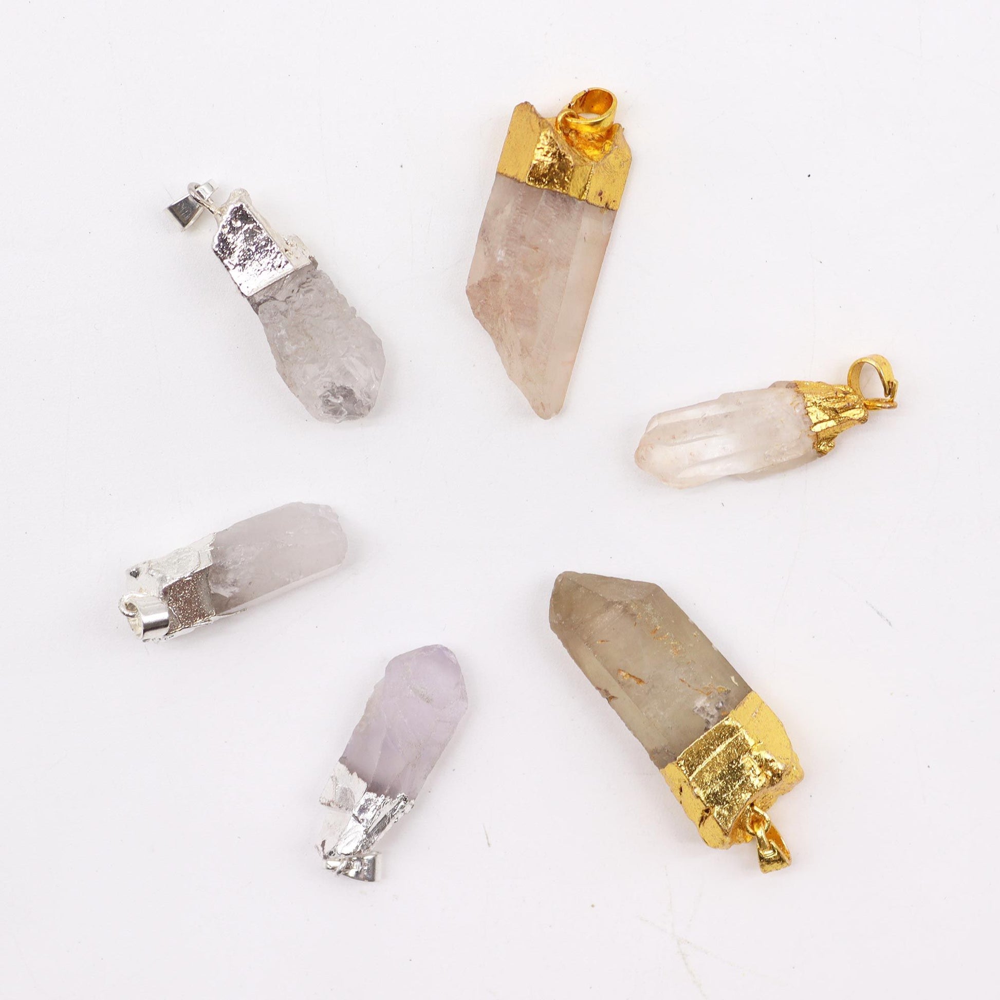 Assorted gemstone clear quartz pendants with elegant gold and silver plated bails.