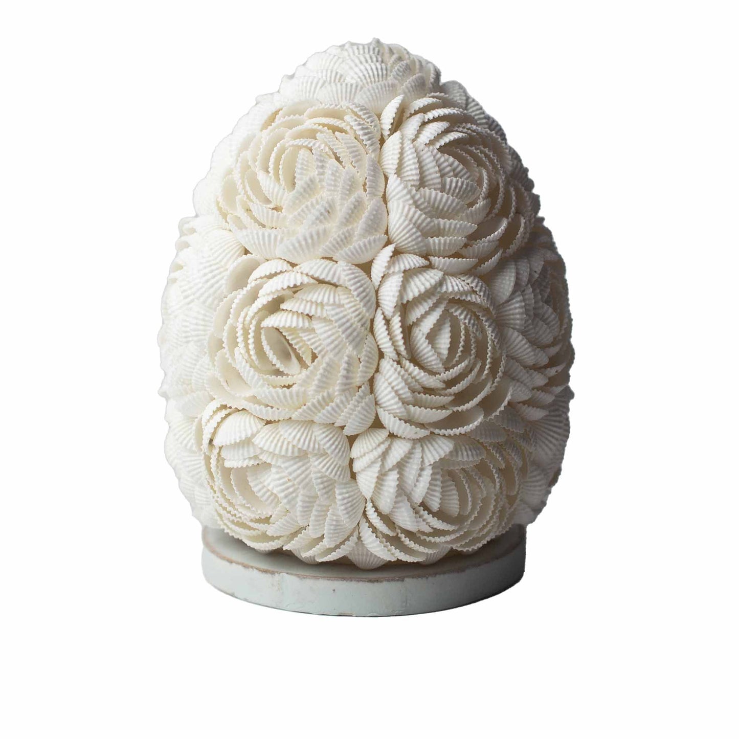 Handcrafted oval lamp made of delicate rose-tinted real seashells arranged in a decorative pattern on a white base.