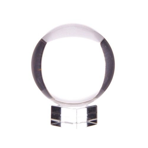 Clear 50mm optical glass crystal ball resting on a simple matching glass stand against a neutral background.