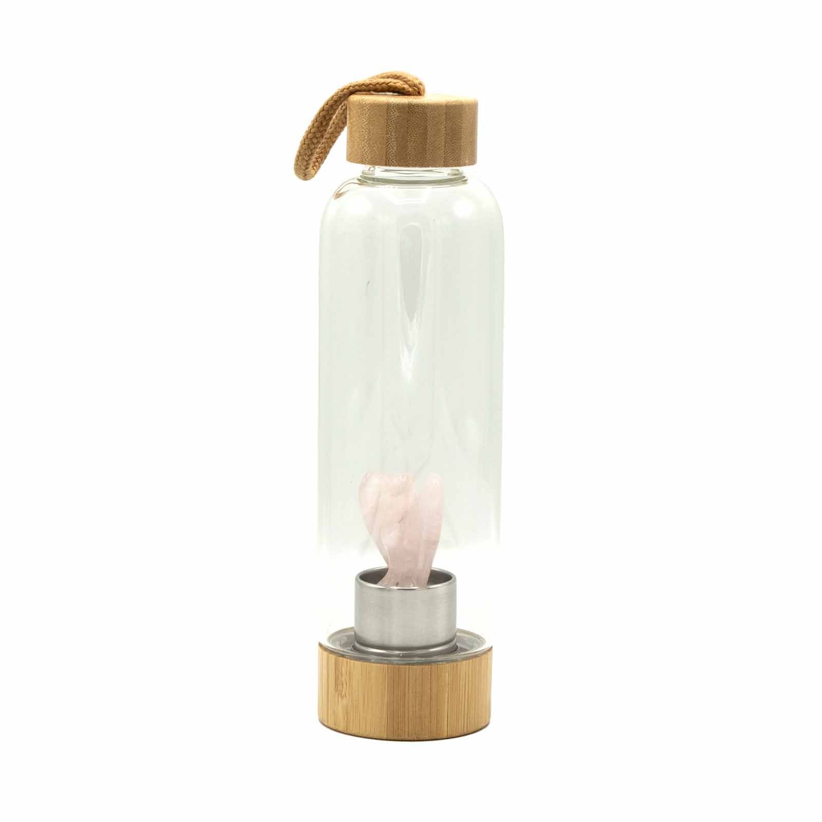 Clear glass water bottle with a pink rose quartz crystal point inside and an angel wing charm on the lid.