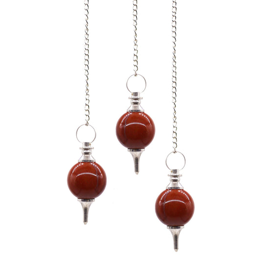 Red jasper sphere pendulum with a polished finish attached to a silver-toned chain with a small crystal bead topper.