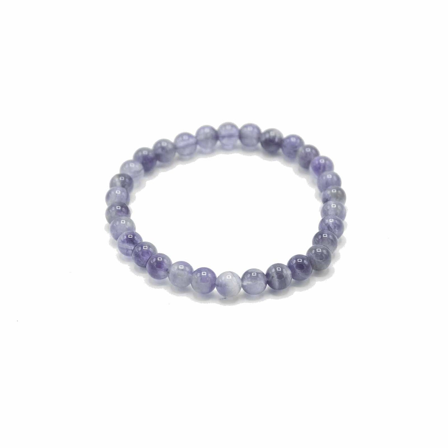 Close-up of a manifestation bracelet featuring smooth, polished purple amethyst gemstone beads on an elasticated cord.