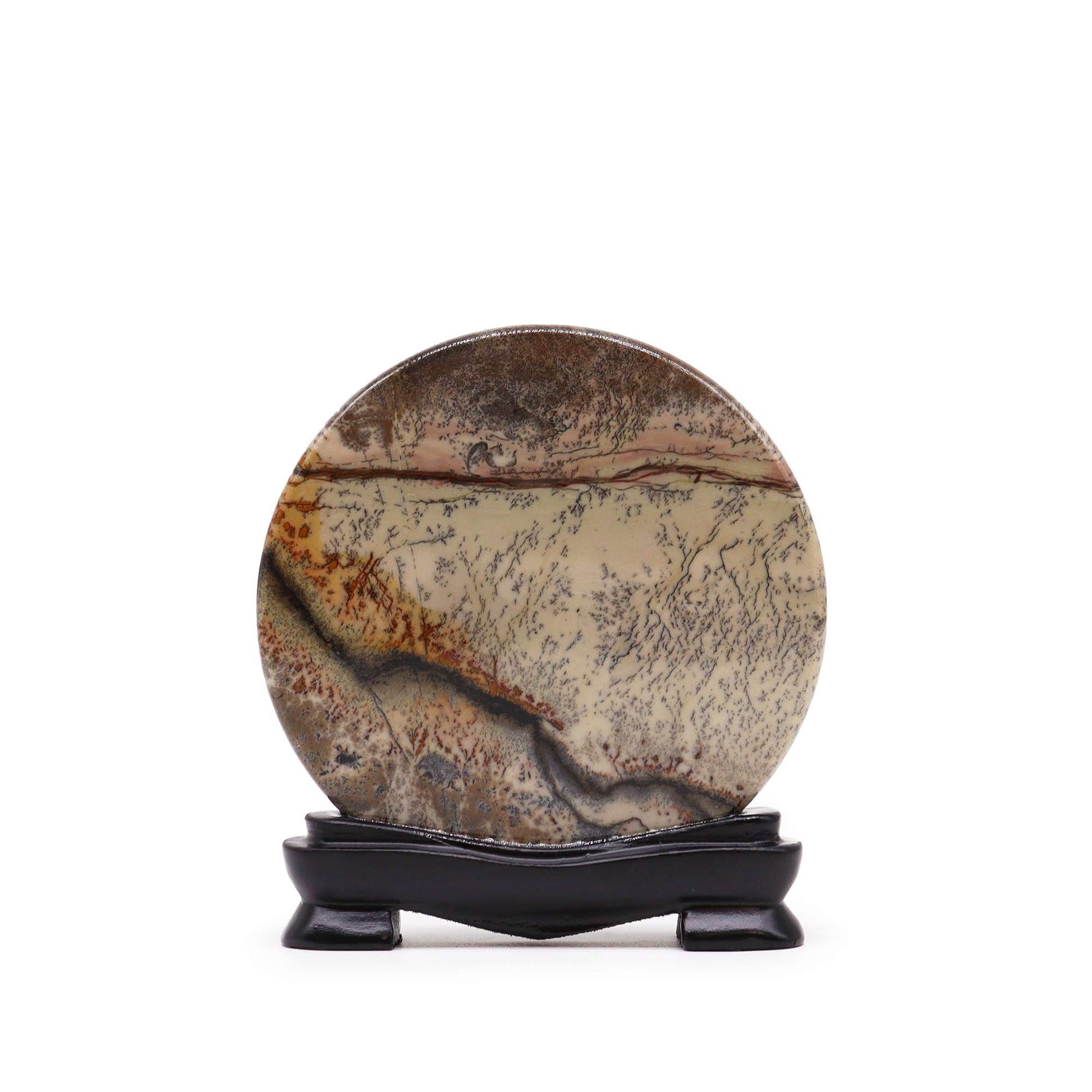 Circular grey limestone disc with natural black fern-like dendritic patterns on a smooth surface.