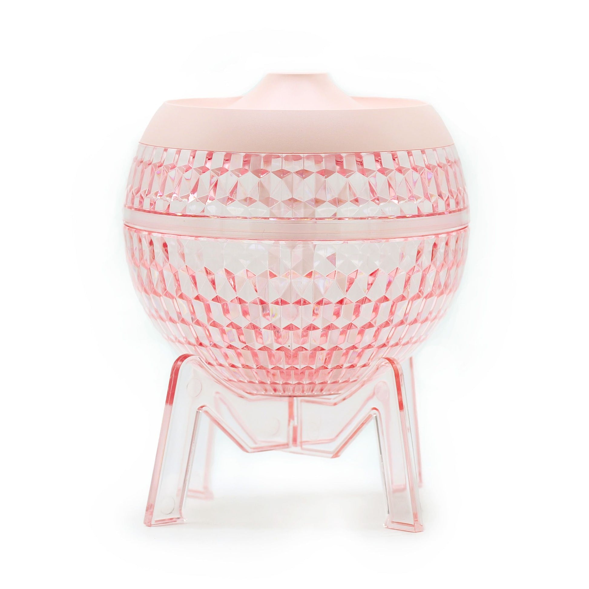Sleek pink globe-shaped humidifier with a transparent base and soft colour-changing down light.