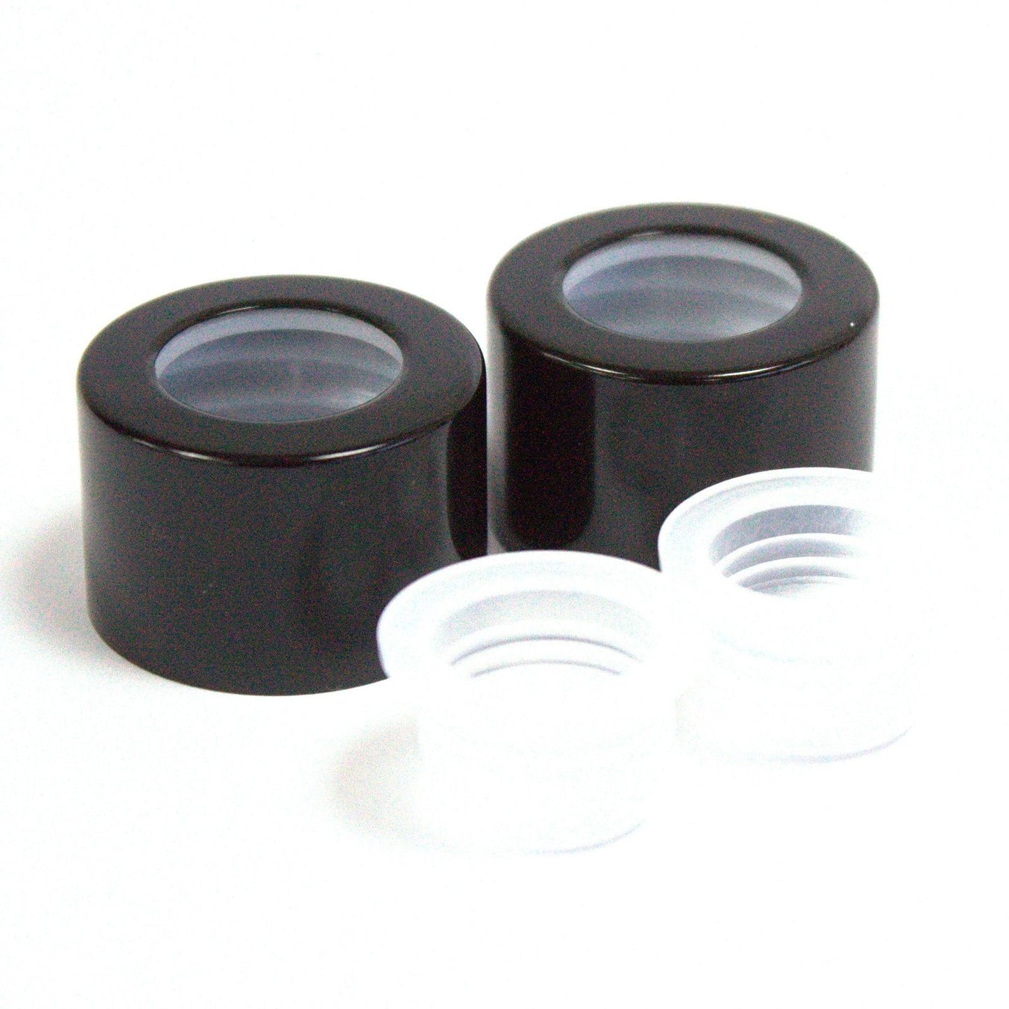 Sleek black replacement cap for reed diffuser bottles featuring a round design and matching travel plug insert.