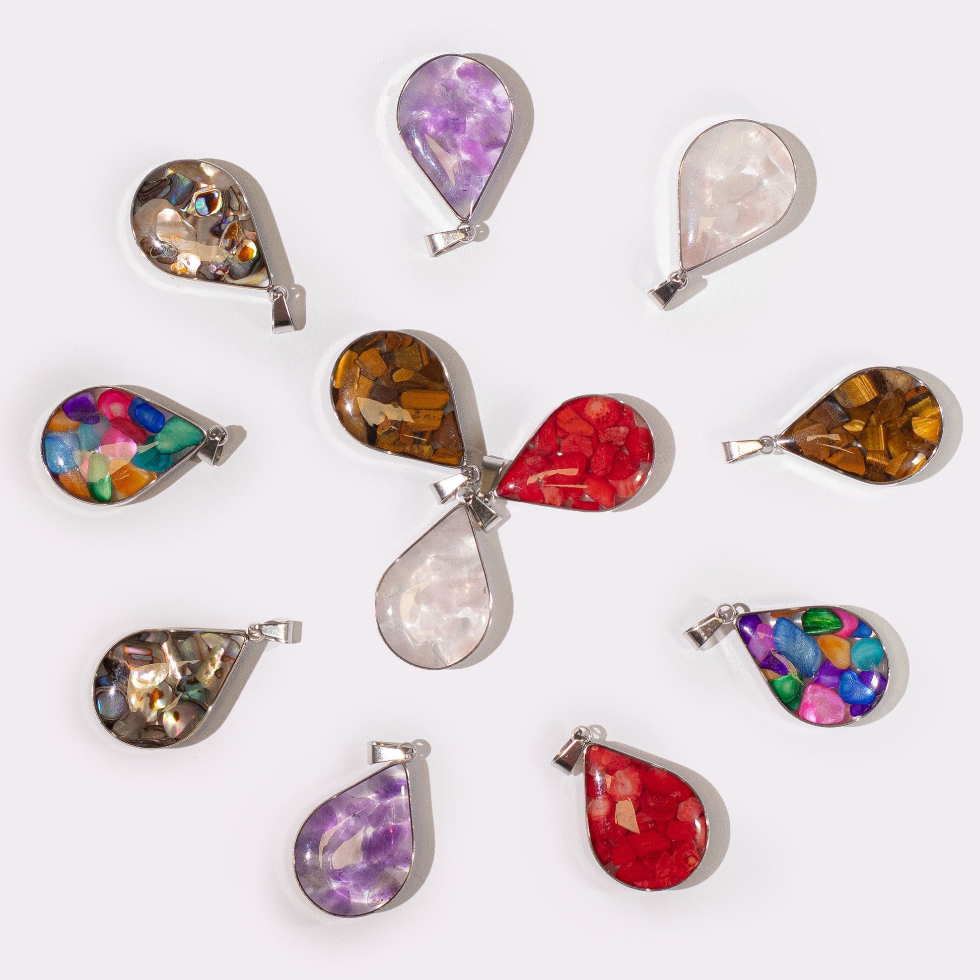 Twelve teardrop shaped steel cased pendants filled with various colourful gemstone chips and natural shells.