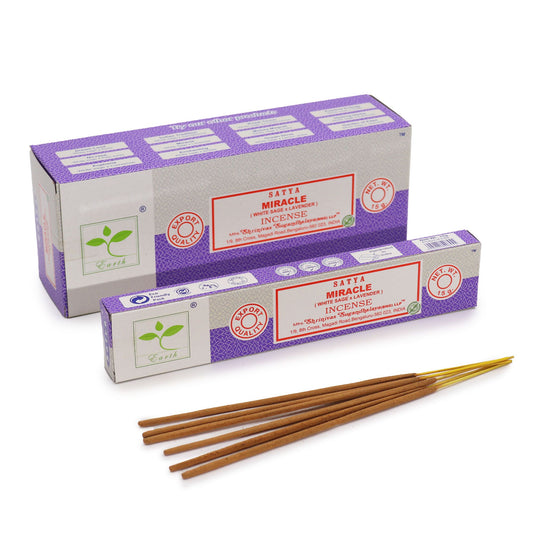 Close-up of hand-rolled incense sticks in a 15g pack featuring floral and herbal notes for spiritual cleansing.