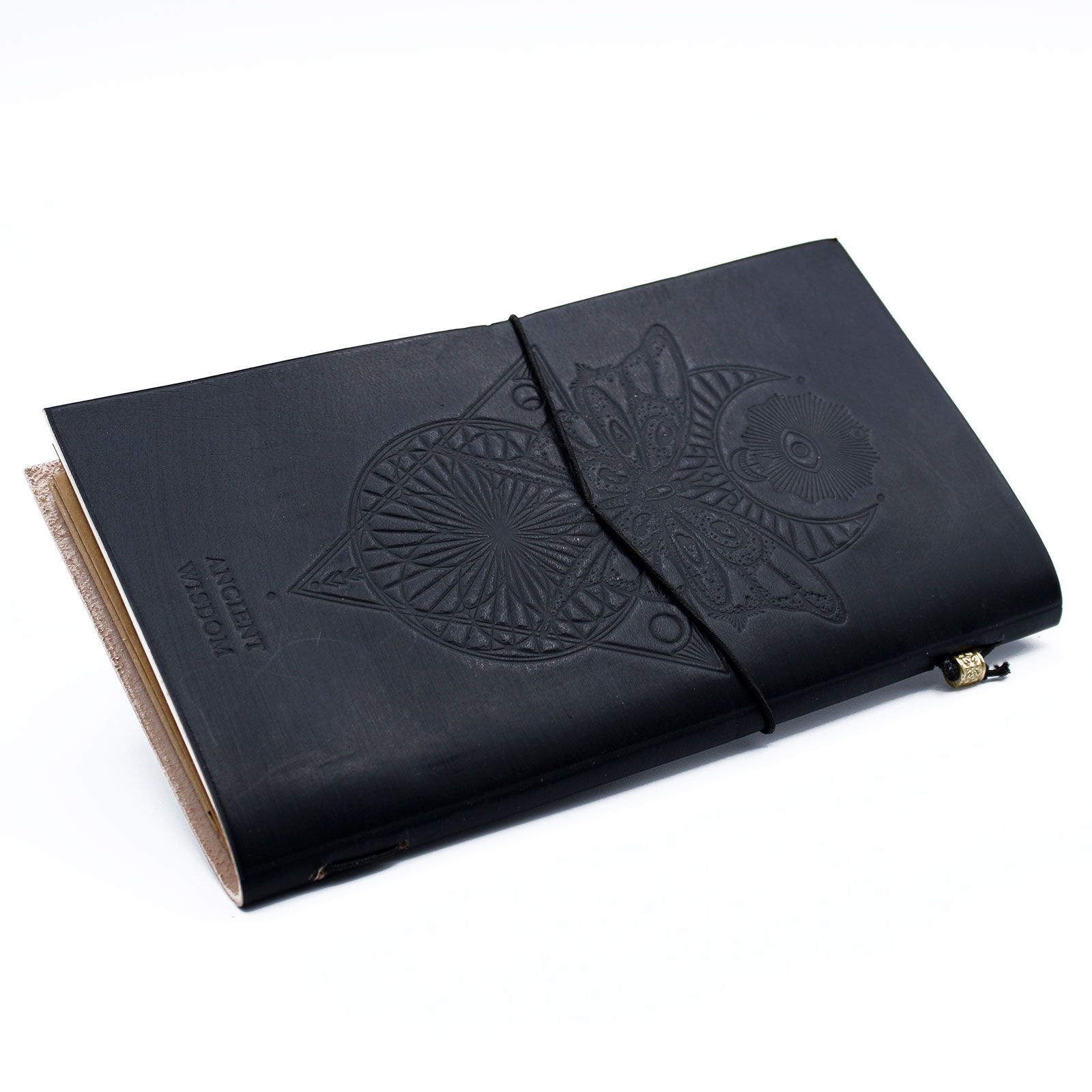 Slim black handmade leather journal with 'My Book of Spells and other Thoughts' embossed on the cover and a wrap-around band.