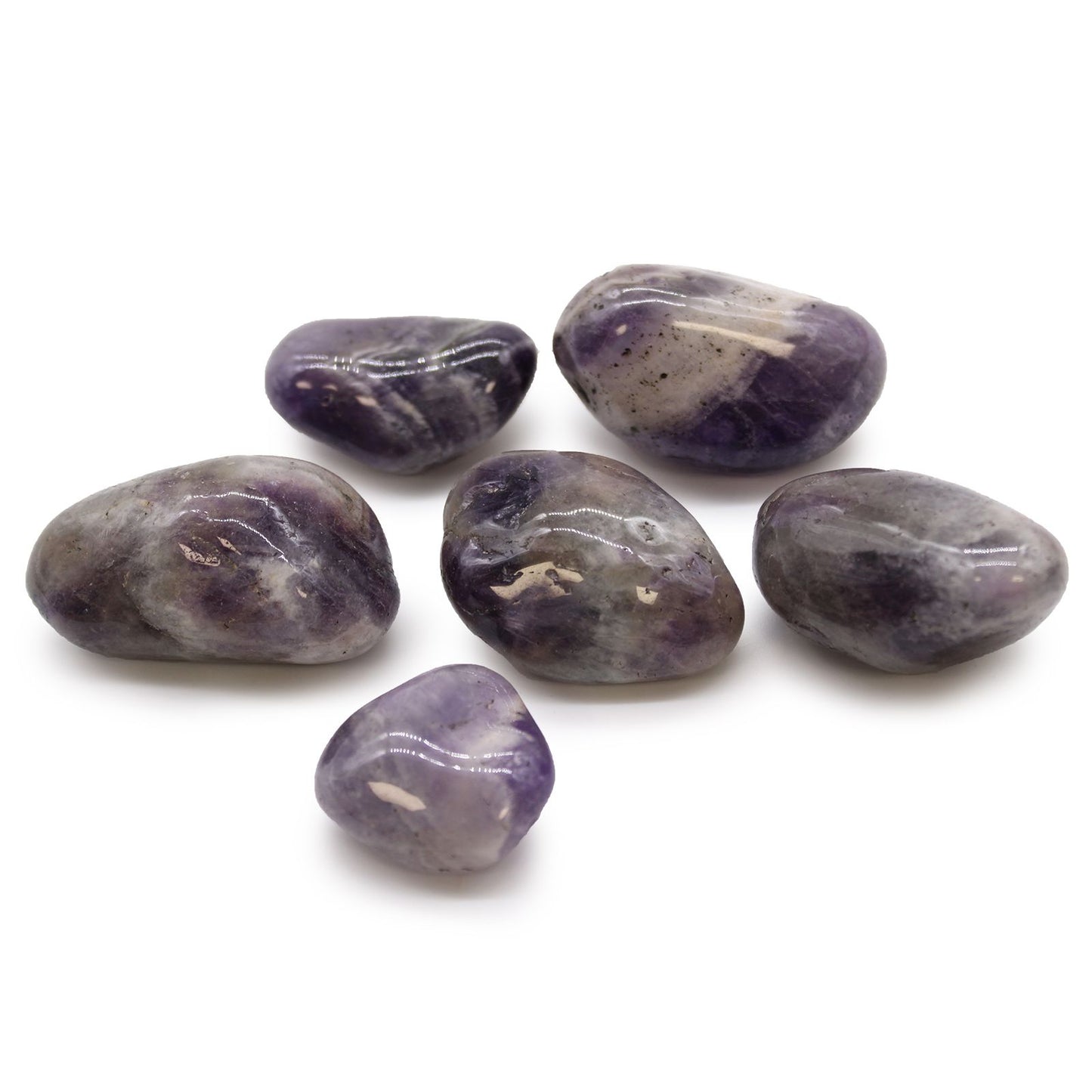 A collection of smooth, large purple African Amethyst tumble stones with natural crystalline inclusions.