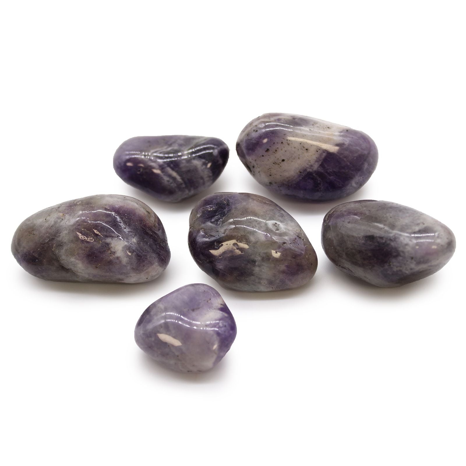 A collection of smooth, large purple African Amethyst tumble stones with natural crystalline inclusions.