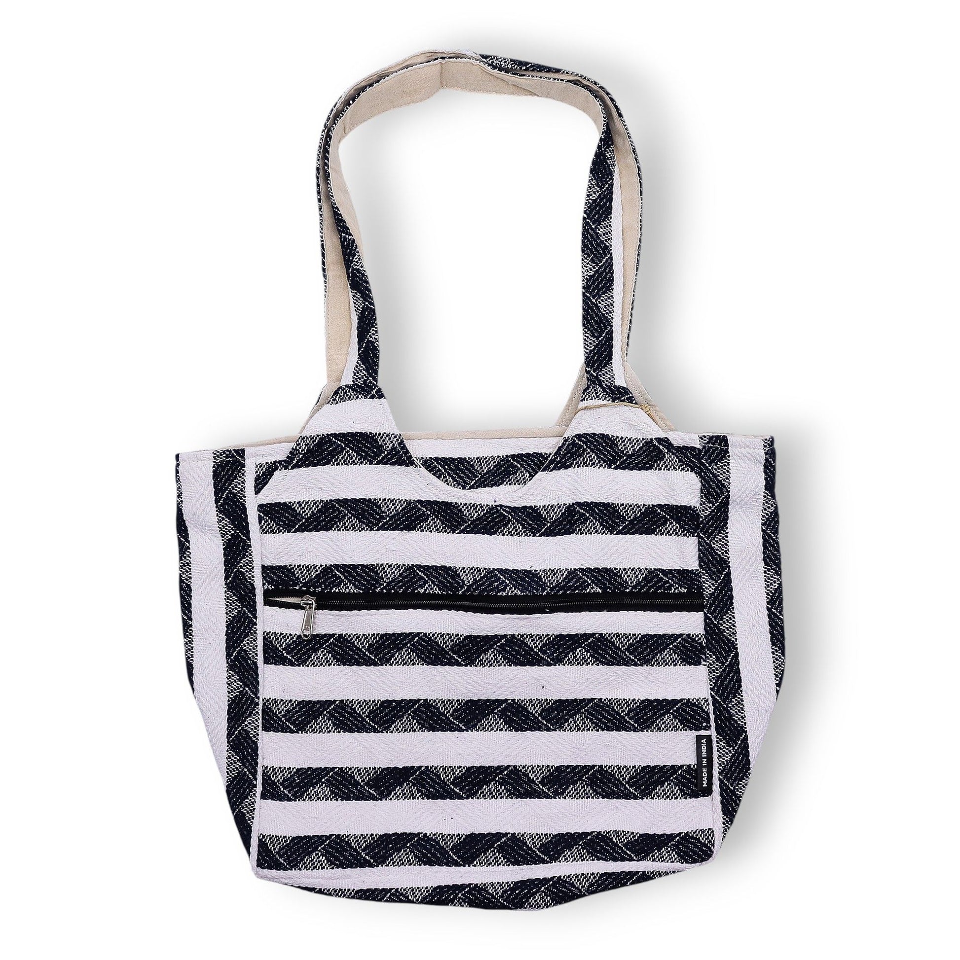 Navy and white patterned jacquard fabric tote bag with a soft handmade texture and woven handles.