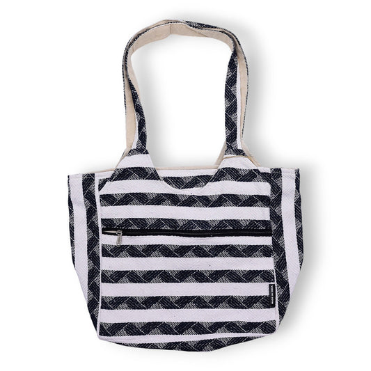 Navy and white patterned jacquard fabric tote bag with a soft handmade texture and woven handles.