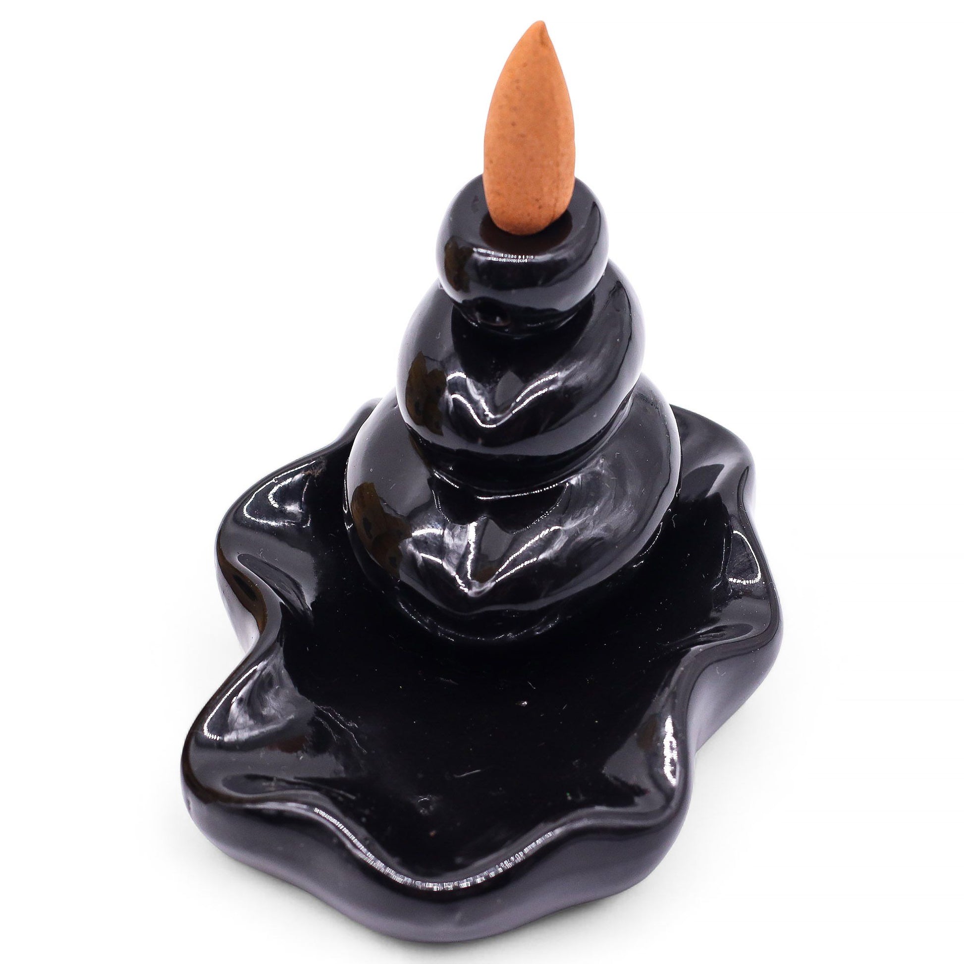 Box of ten hexagon-shaped masala backflow incense cones featuring tropical coconut and mango scent.