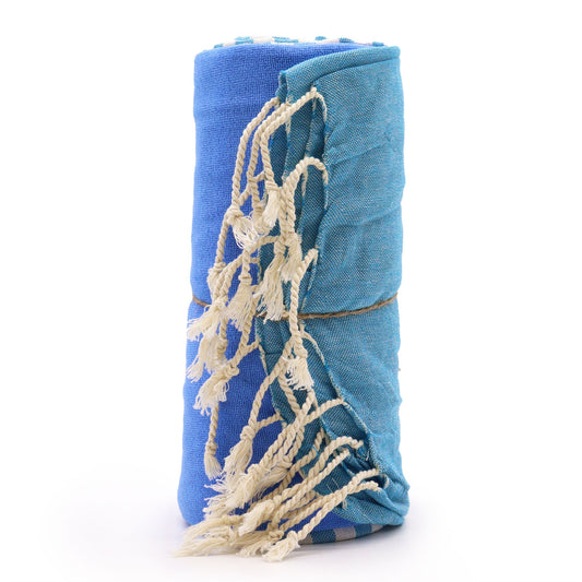 Handcrafted sky blue cotton pareo towel with a soft textured weave and delicate fringed edges.