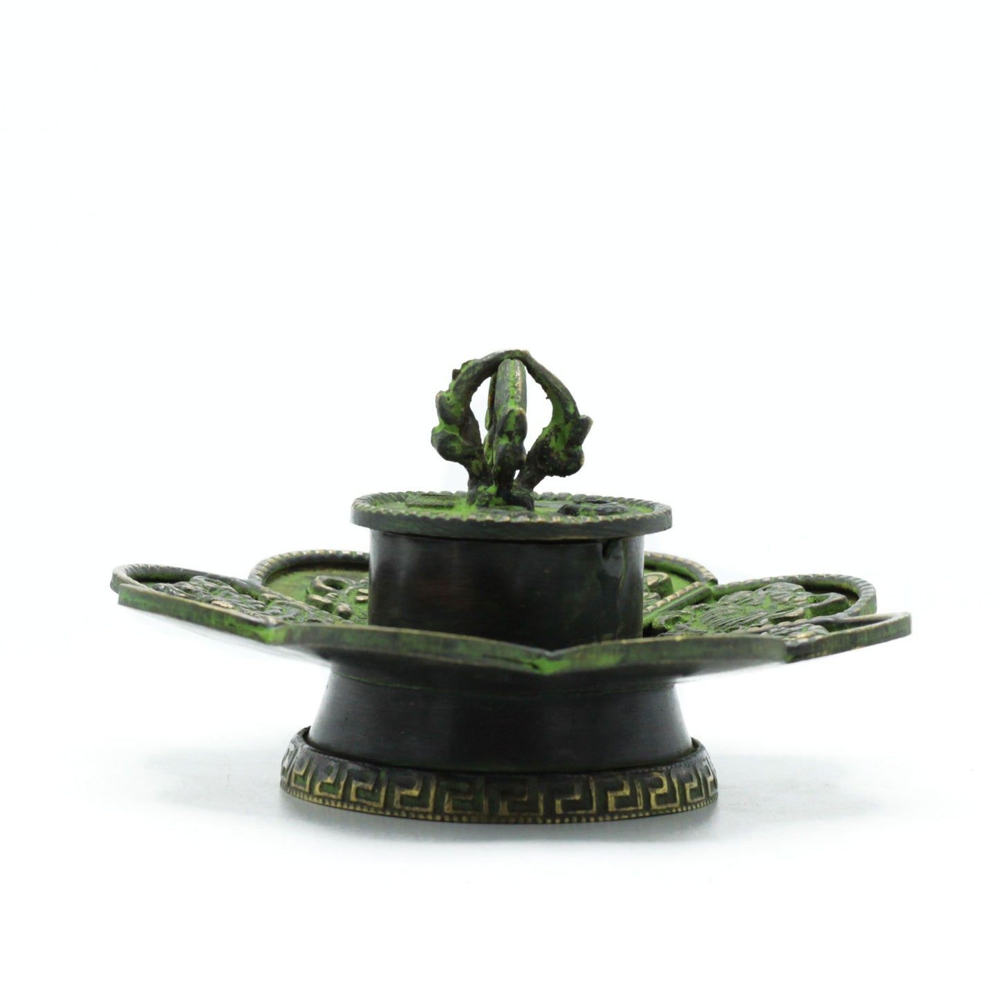Handcrafted flower-shaped brass incense holder with a green verdigris finish and embossed Tibetan eight symbols.
