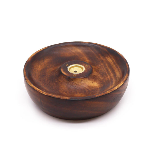 Minimalist circular wooden incense burner disc with a central hole for sticks and a flat surface for cones.