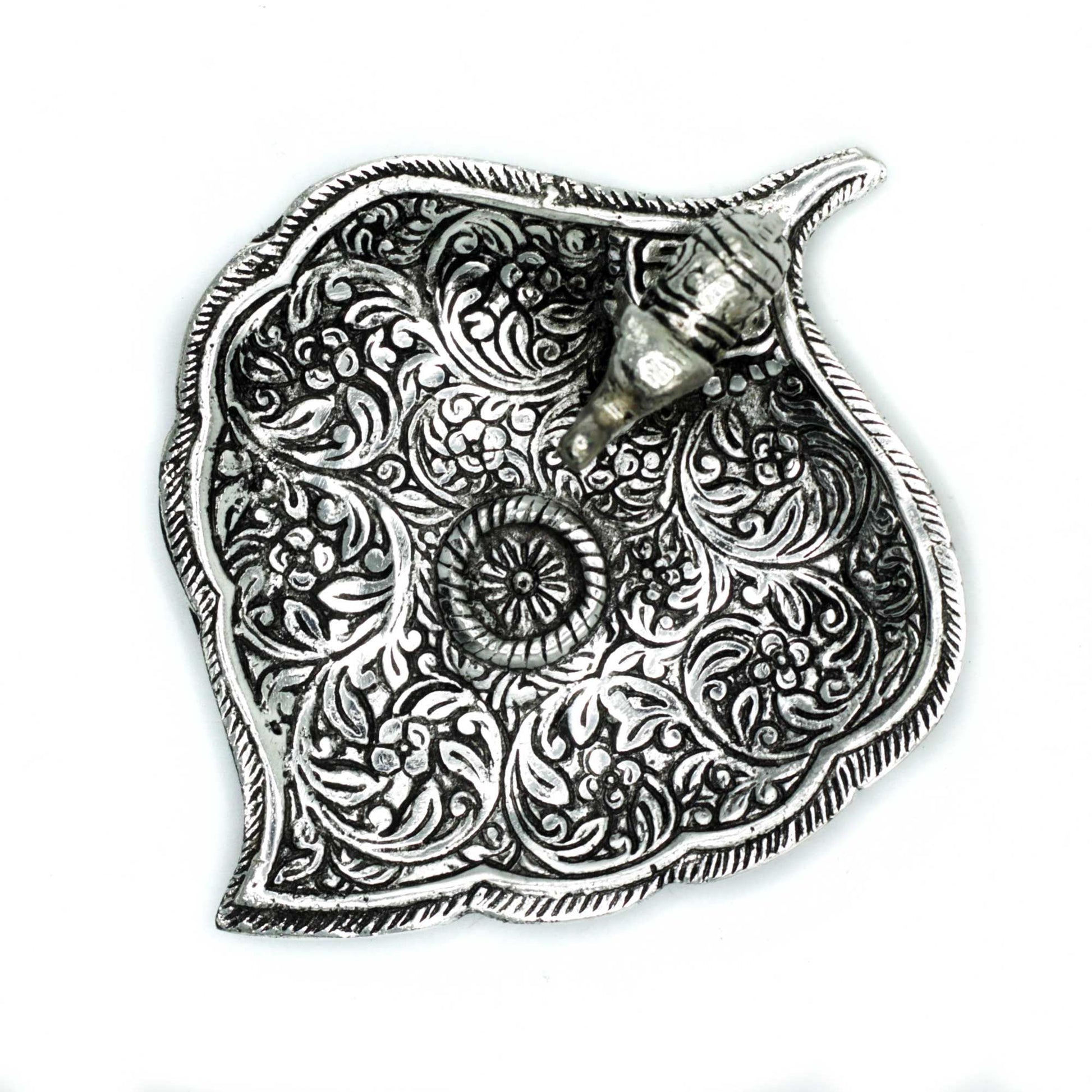 Small polished aluminium incense holder featuring a detailed elephant standing on a decorative leaf-shaped base.
