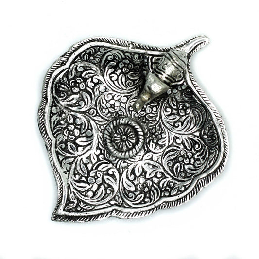 Small polished aluminium incense holder featuring a detailed elephant standing on a decorative leaf-shaped base.