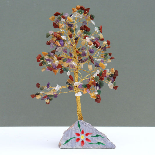 Handcrafted gemstone tree featuring 320 multi-coloured crystal stones with adjustable wire branches on a natural rock base.