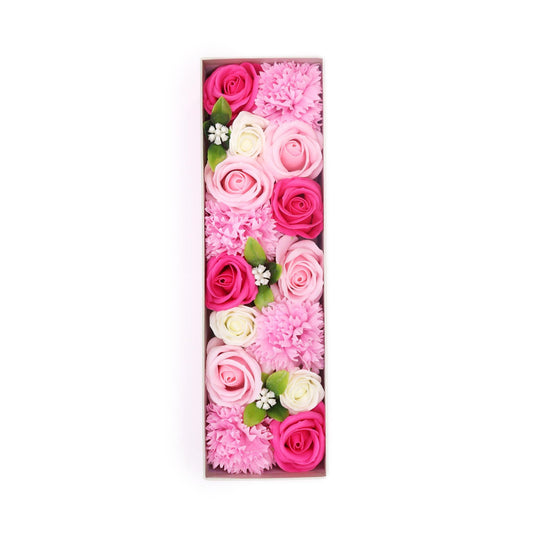 Elegant long gift box filled with delicate pink soap flower roses and carnations.