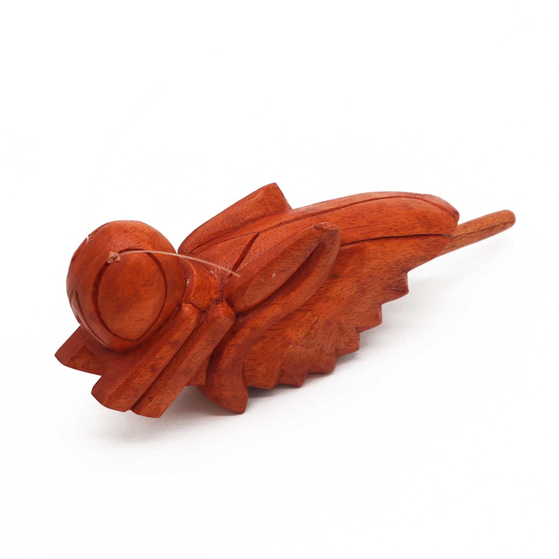 Handcrafted wooden grasshopper musical instrument designed to create a rhythmic chirping sound.