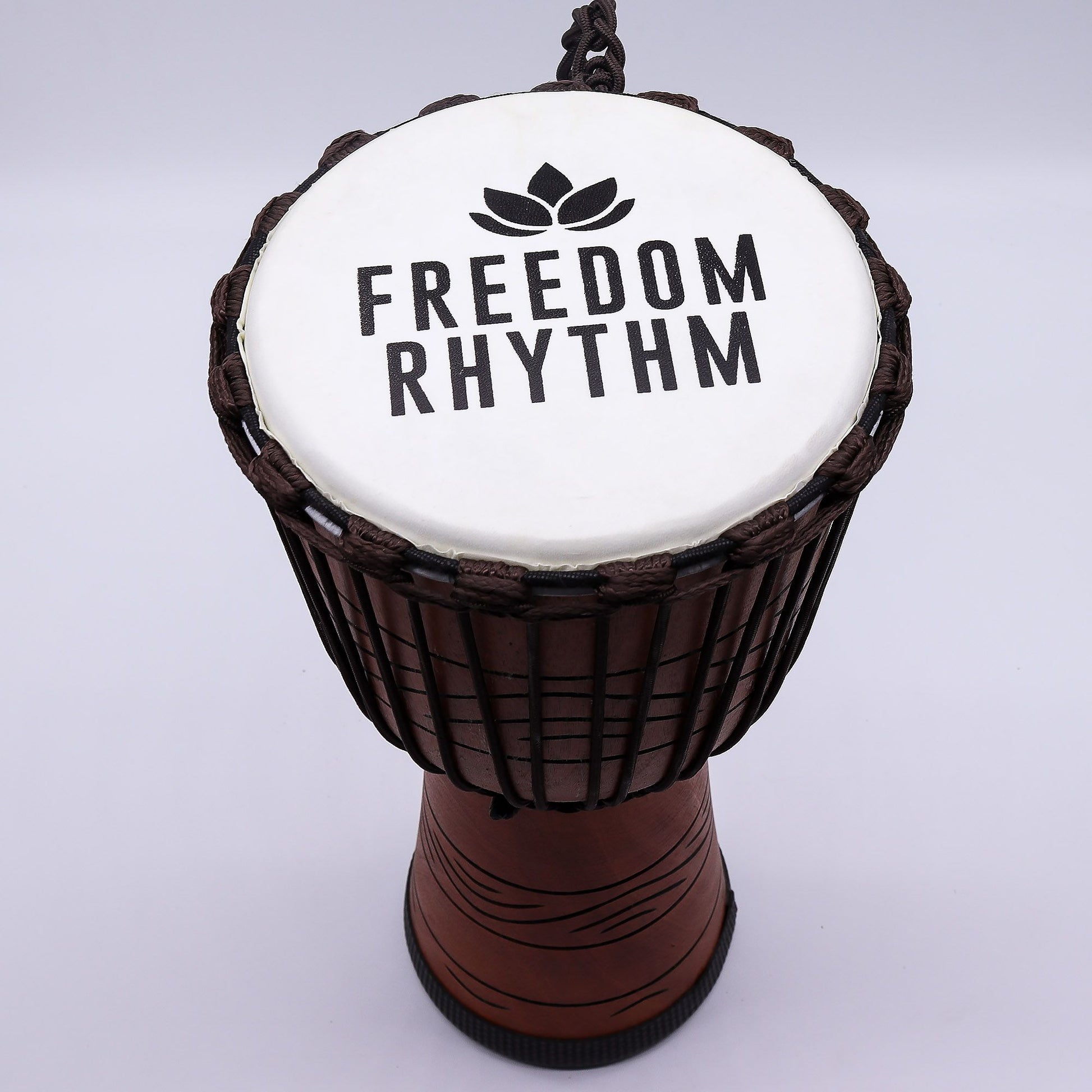 Handcrafted 50cm tall professional djembe drum with a 22cm goat skin head and decorative rope tuning.