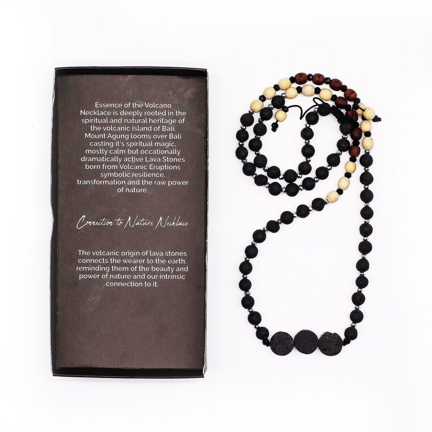 Handcrafted natural black lava stone necklace with a rugged organic texture on a simple cord.