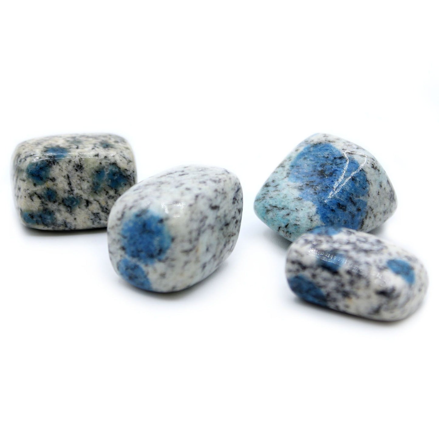 Polished K2 Jasper tumble stone featuring distinctive blue azurite orbs on a speckled white and grey granite matrix.