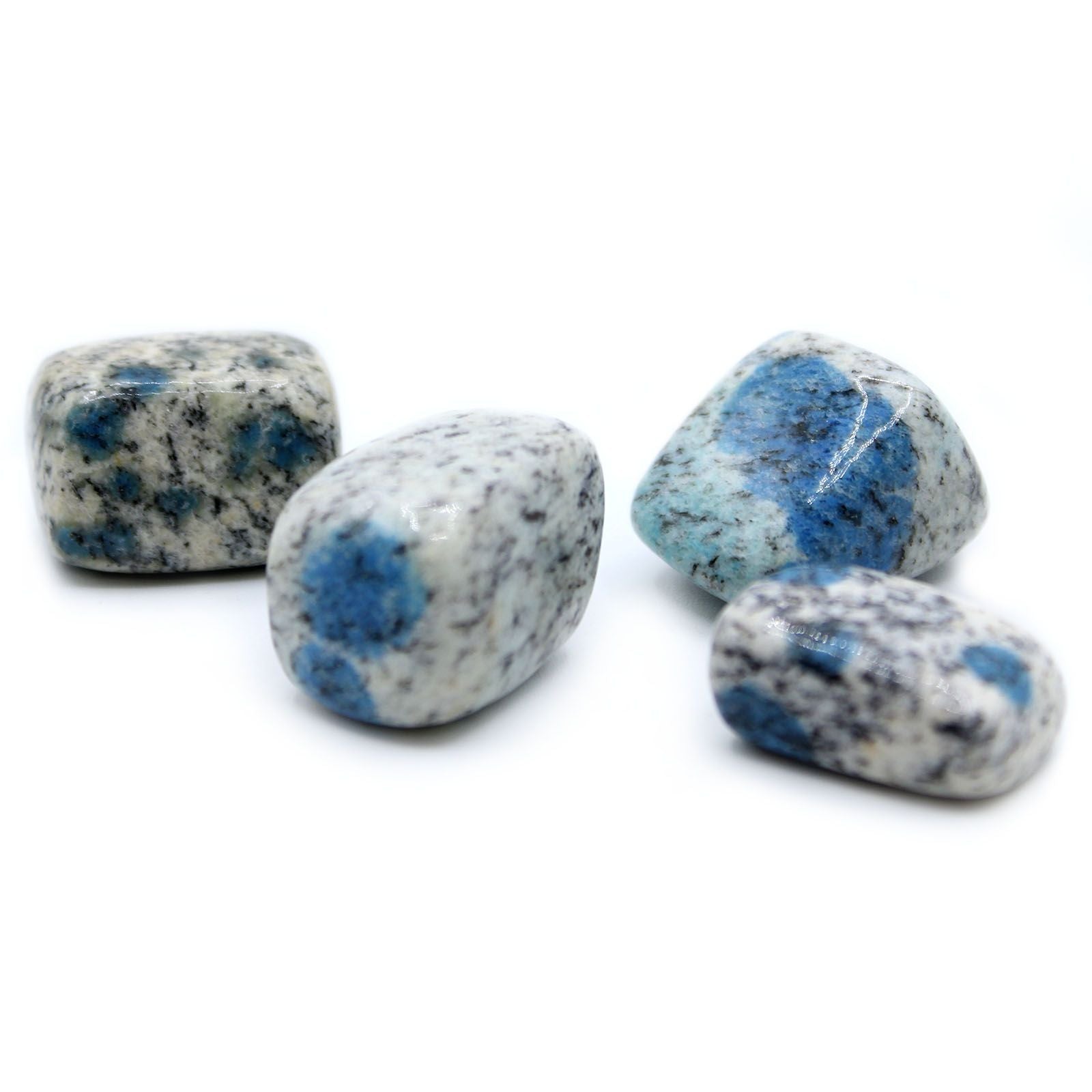 Polished K2 Jasper tumble stone featuring distinctive blue azurite orbs on a speckled white and grey granite matrix.