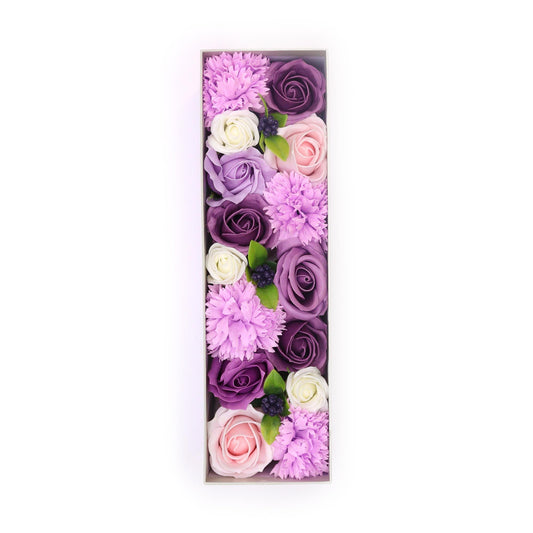 Elegant long gift box filled with realistic soap flowers in shades of lavender, pink, and white.