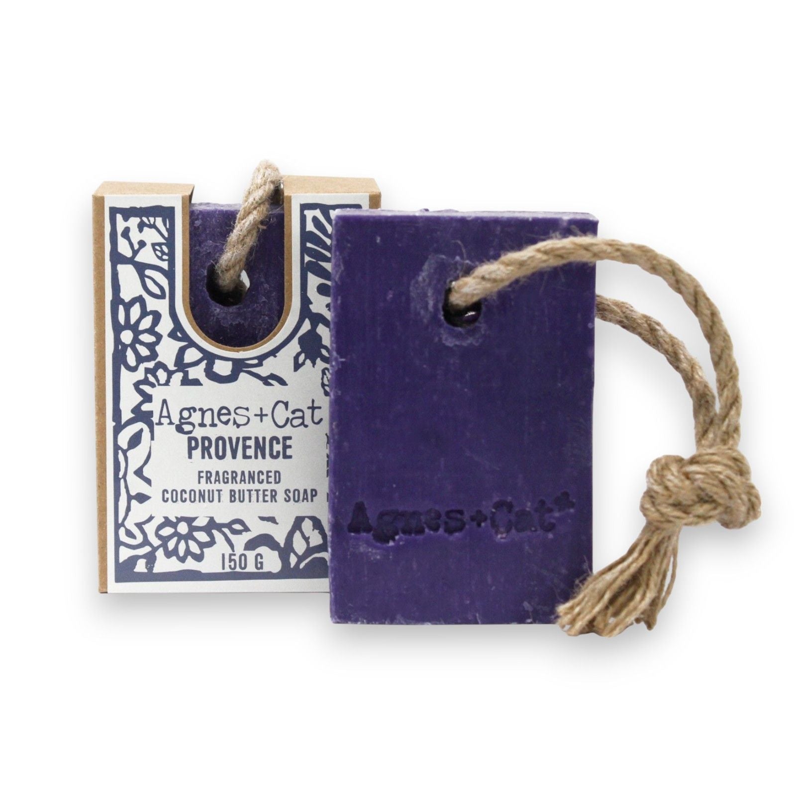 Artisanal bar of soap on a natural hanging rope with a rustic textured surface.