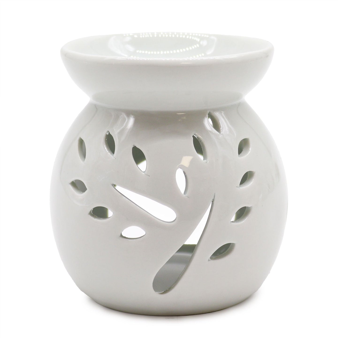Large elegant white ceramic oil burner with a delicate tree-shaped cut-out design on the front.