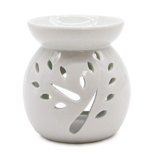 Large elegant white ceramic oil burner with a delicate tree-shaped cut-out design on the front.